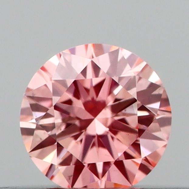 Actual 0.2 carat Vivid Pink Round lab-grown diamond