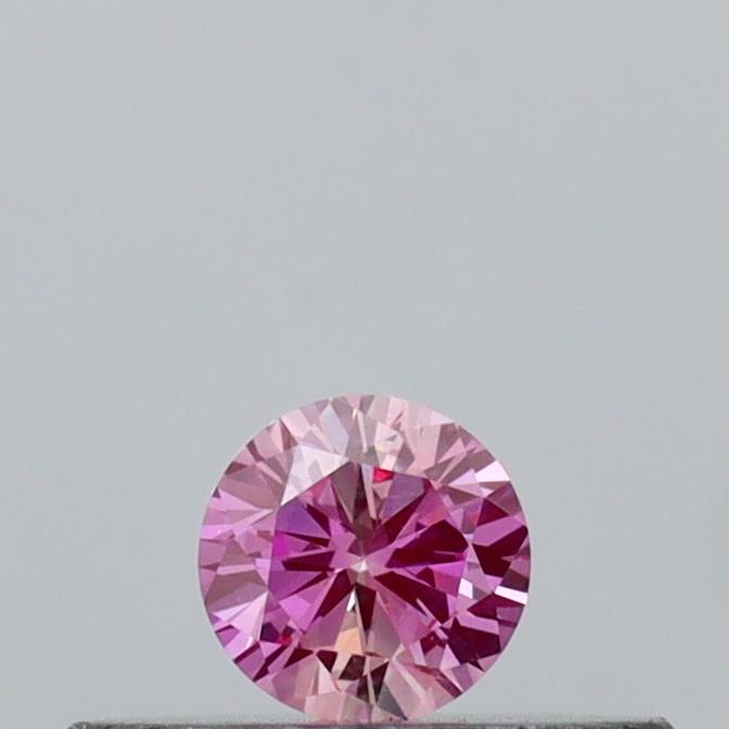 Actual 0.13 carat Vivid Pink Round lab-grown diamond