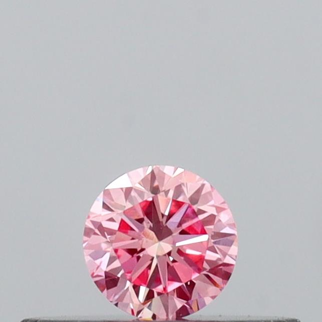 Actual 0.14 carat Vivid Pink Round lab-grown diamond