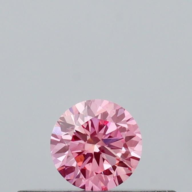 Actual 0.16 carat Vivid Pink Round lab-grown diamond