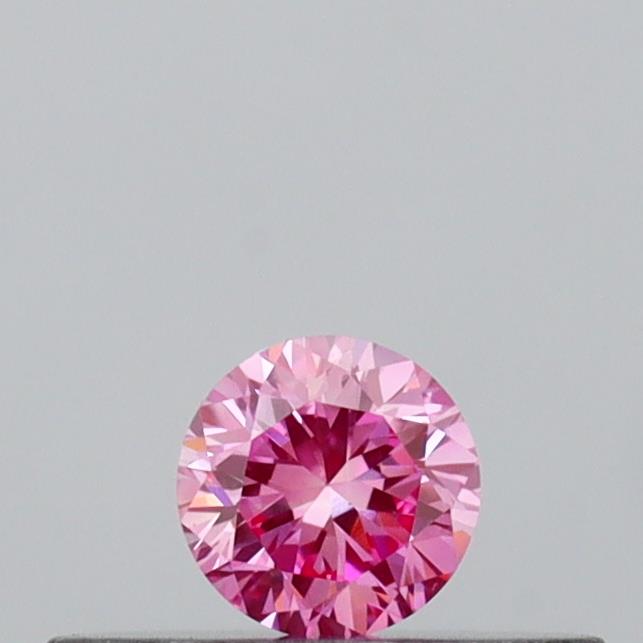 Actual 0.14 carat Vivid Pink Round lab-grown diamond