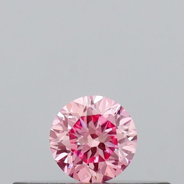 Actual 0.14 carat Vivid Pink Round lab-grown diamond