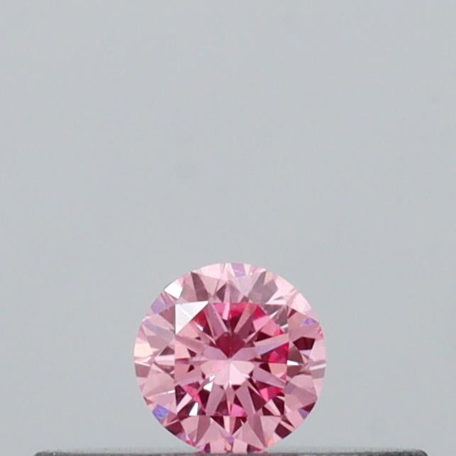 Actual 0.09 carat Vivid Pink Round lab-grown diamond