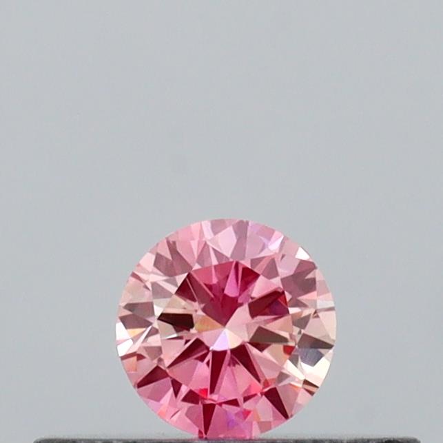 Actual 0.14 carat Intense Pink Round lab-grown diamond