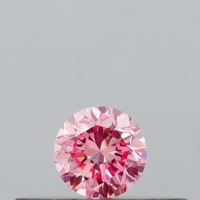 Actual 0.14 carat Vivid Pink Round lab-grown diamond