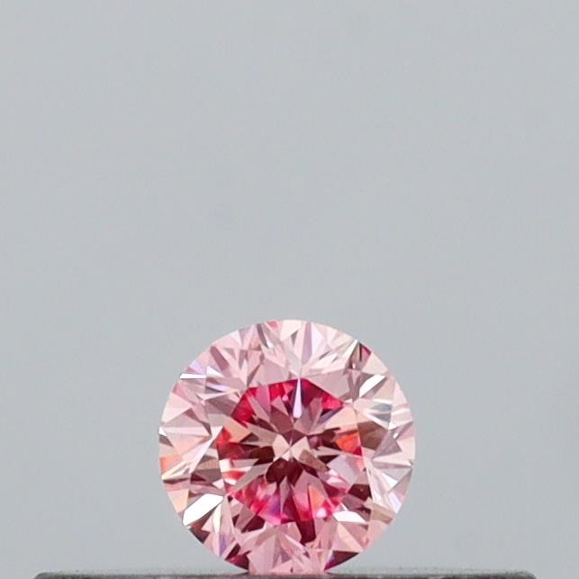 Actual 0.11 carat Intense Pink Round lab-grown diamond