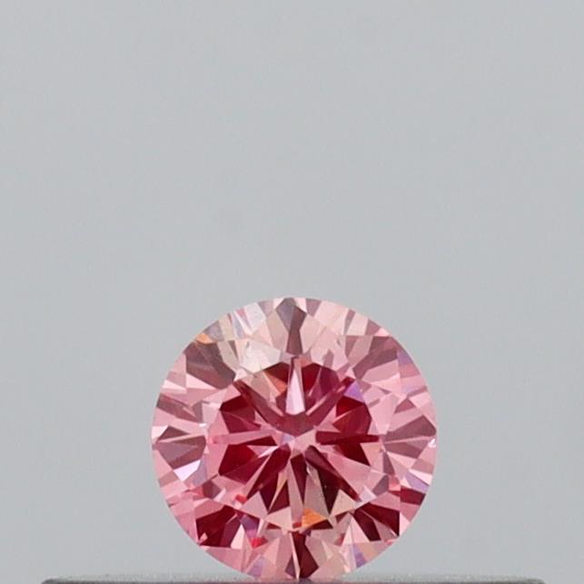 Actual 0.14 carat Vivid Pink Round lab-grown diamond