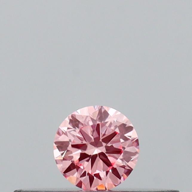Actual 0.11 carat Vivid Pink Round lab-grown diamond