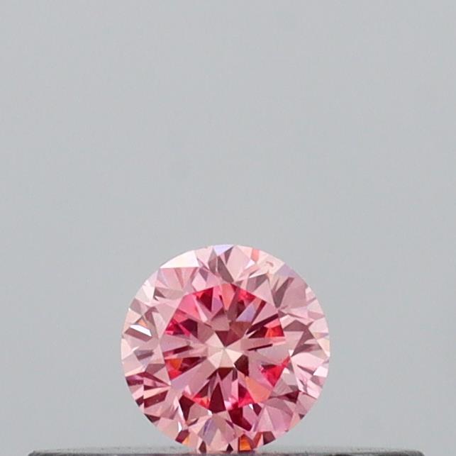 Actual 0.13 carat Vivid Pink Round lab-grown diamond